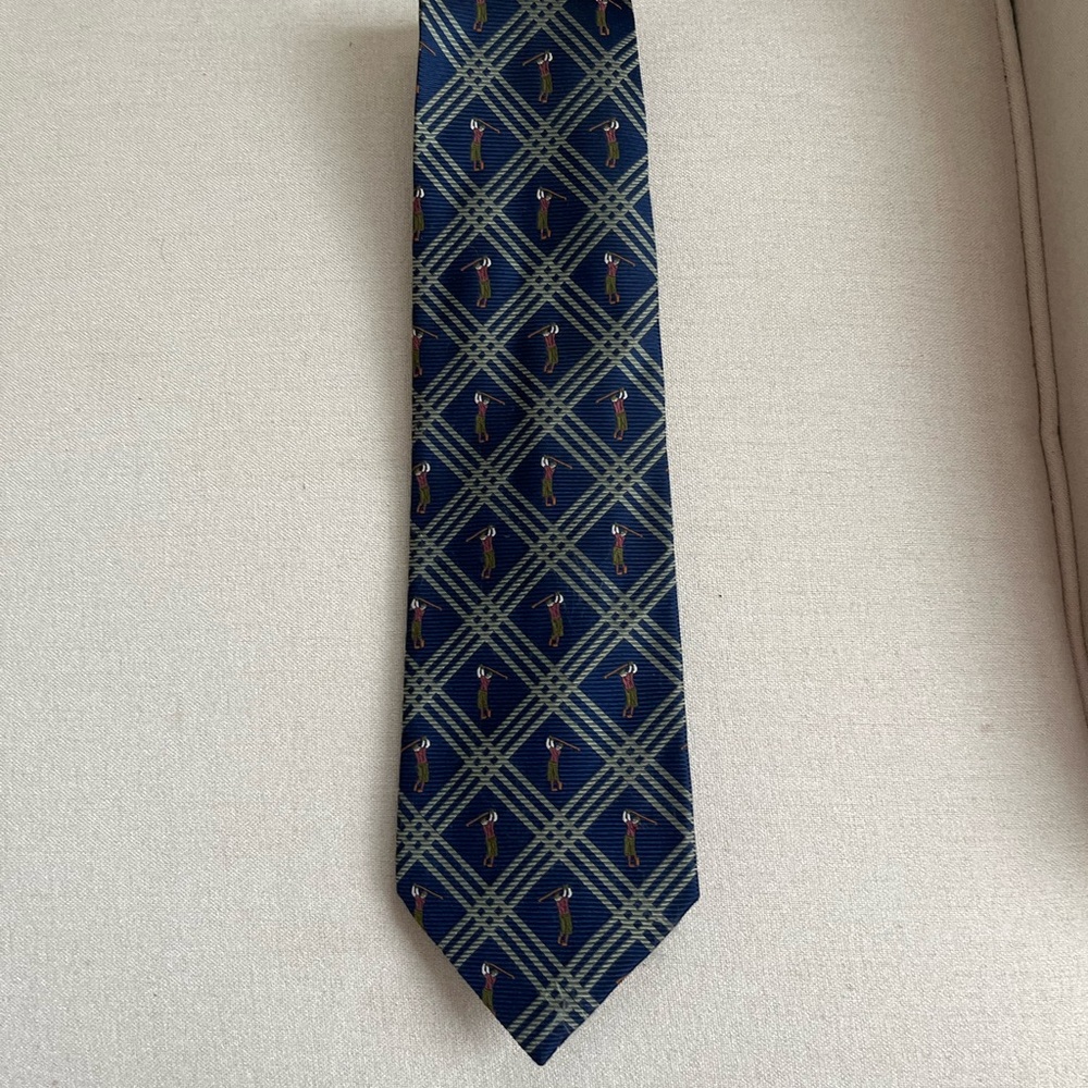 Man’s Tommy Bahama tie with golfer on it